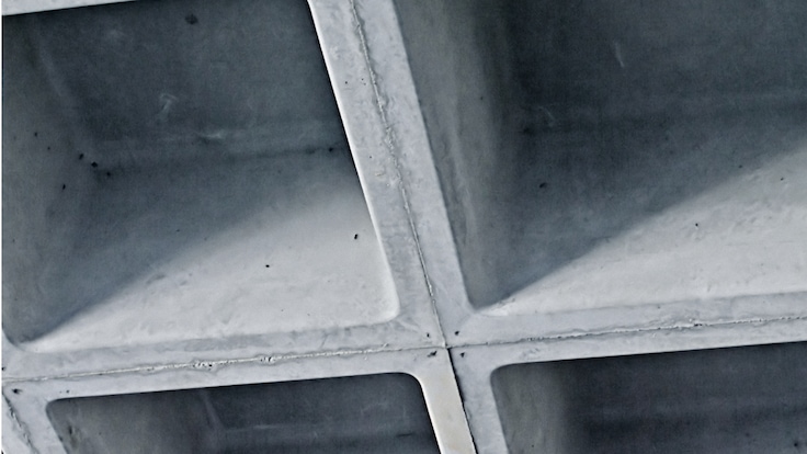 A close up of a grey coloured concrete waffle slab.