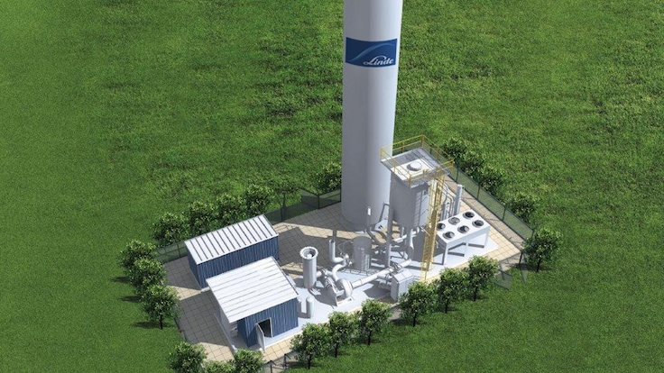An on-site oxygen supply plant in a green field with large Linde branded storage tank